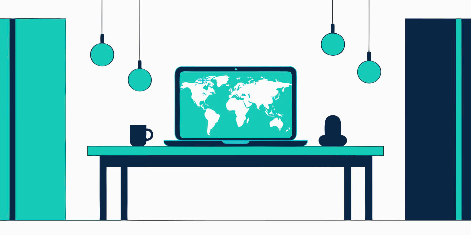Laptop displaying a world map at a remote work desk
